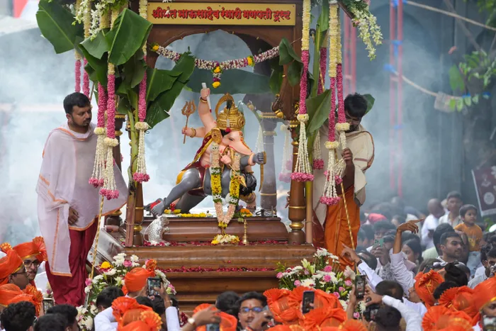 Shimla: Devotees carry an idol of Lord Ganesha during a Ganesh Chaturthi procession held as part of Ganesh Utsav celebrations, in Shimla, Himachal Pradesh, on Monday, September 14, 2026.